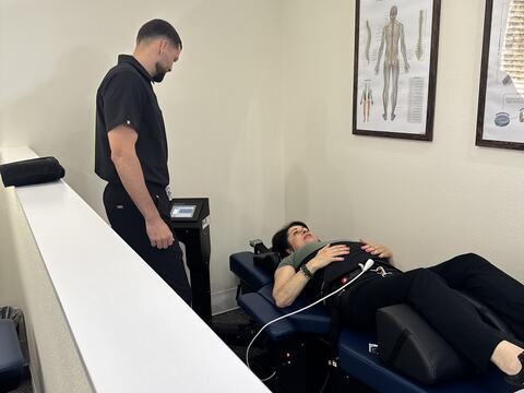 Dr. Toro treating a patient on the decompression table