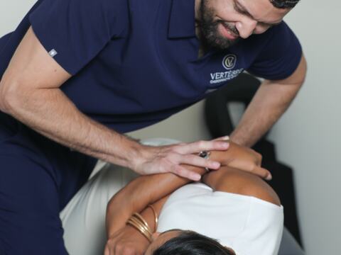 Dr. Toro treating the upper neck of a patient