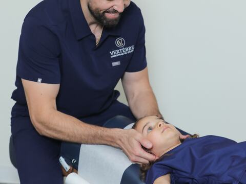 Dr. Toro giving a gentle neck adjustment