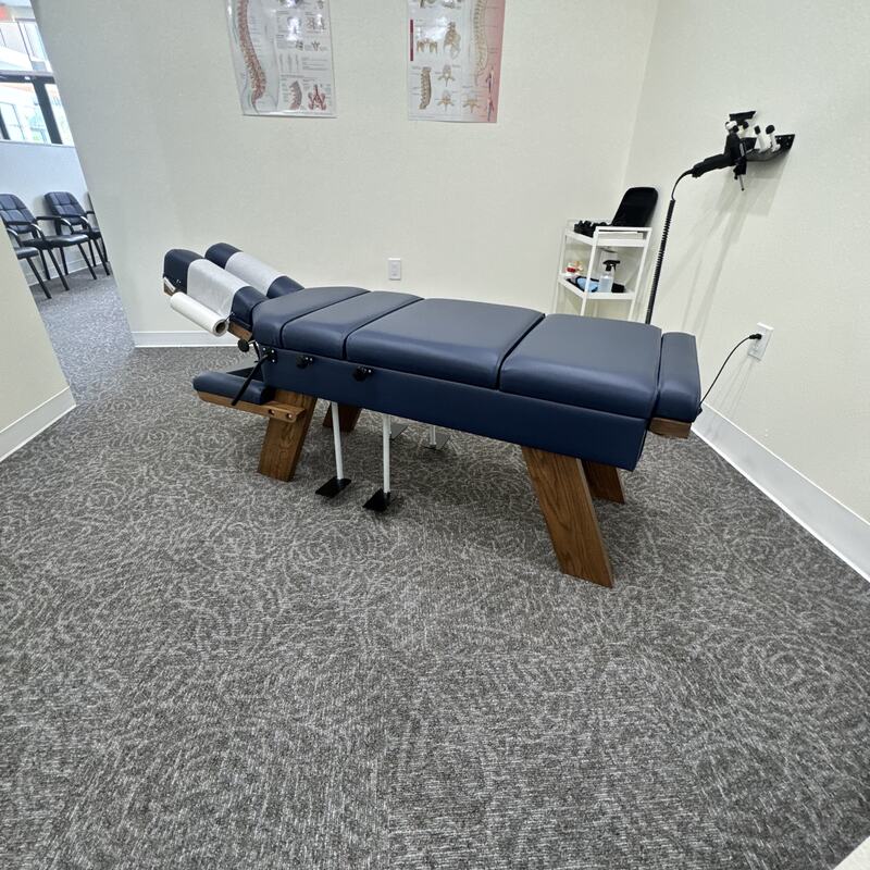 Adjusting table in a treatment room at Vertebre Chiropractic Studio
