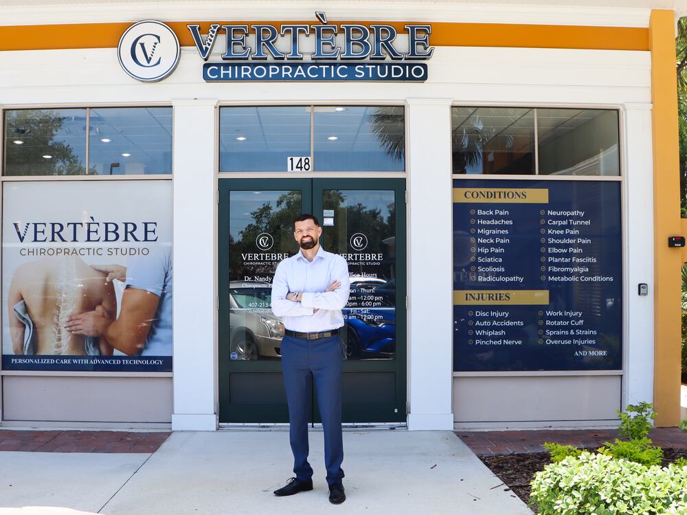 Dr. Nandy Toro outside Vertebre Chiropractic Studio on Tilden Rd, Winter Garden